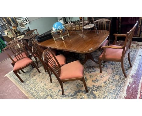 Dining table and set of 12 Chippendale style dining chairs to include 2 carvers 