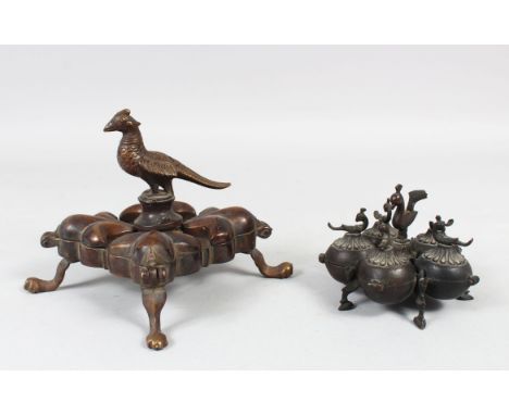 TWO 19TH CENTURY INDIAN BRASS SPICE BOXES WITH BIRD FINIAL, 10cm x 12cm wide.