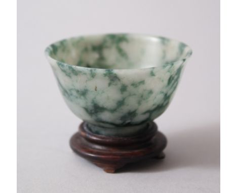 A 19TH / 20TH CENTURY CHINESE JADE TEA BOWL &amp; STAND, 5.4cm diameter x 3.2cm high.