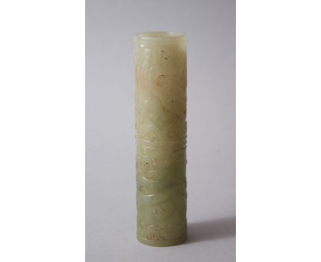 A LATE 19TH CENTURY CHINESE JADE CARVED INCENCE HOLDER, carved with scenes of mythical dragon / dog decoration. 13.5cm high x