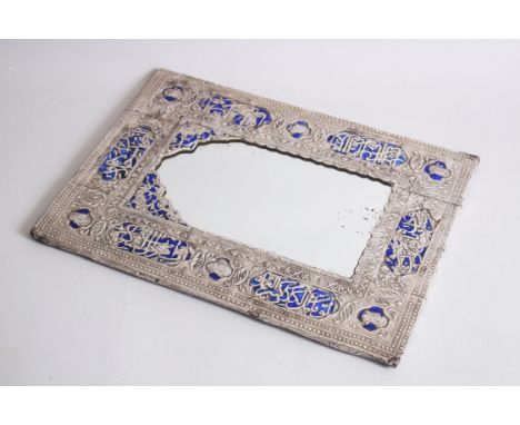 AN ISLAMIC MIDDLE EASTEN EMBOSSED SILVER AND BLUE ENAMEL MIRROR, 32cm high, 22cm wide.
