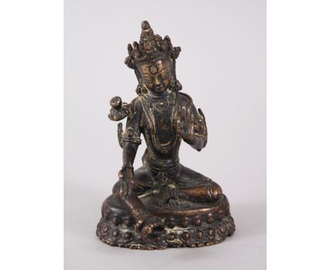 A GOOD EARLY CHINESE BRONZE STATUE OF BUDDHA / DEITY, sat upon a lotus formed base with one leg stretched, 11cm high x 7.5cm 