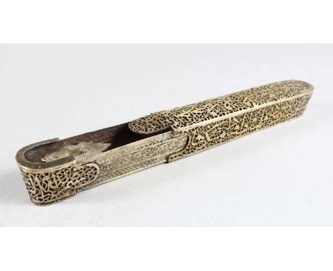 A 19TH-20TH CENTURY PERSIAN QAJAR QALAMDAN OPEN WORK BRASS PEN BOX with inkwell, 22cm long.