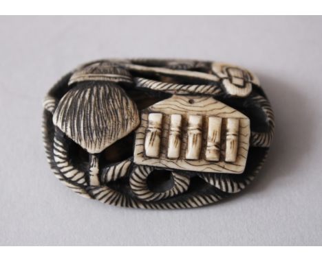 A JAPANESE MEIJI PERIOD CARVED &amp; STAINED IVORY NETSUKE OF ROPE AND UTENSILS, 4cm wide x 3cm deep.