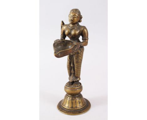 A SOUTH INDIAN BRASS OIL LAMP FIGURE OF LAKSHMI.