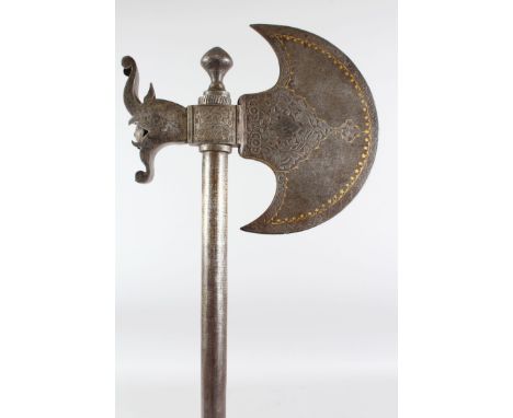 A 19TH CENTURY PERSIAN QAJAR GOLD INLAID STEEL AXE, 72cm long.