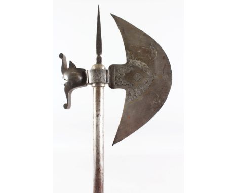 A 19TH CENTURY PERSIAN QAJAR GOLD INLAID STEEL AXE, 76cm long.