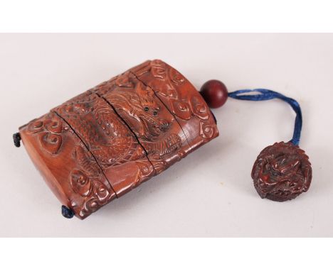 A GOOD JAPANESE MEIJI PERIOD CARVED WOODE THREE CASE INRO &amp; NETSUKE, the inro carved to depict a dragon amongst clouds, t
