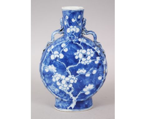 A 19TH CENTURY CHINESE PORCELAIN PRUNUS MOON FLASK, with typical prunus decoration, the moulded handles of lizards, the base 