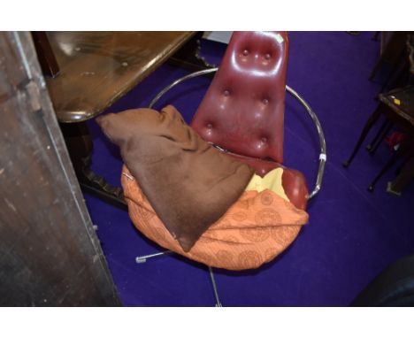 A vintage vinyl swivel armchair having button back and seat and chrome frame, seat damaged and replaced with loose cover
