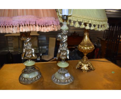 A pair of part onyx cherub table lamps and a gilt metal table lamp