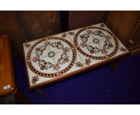 A vintage teak and tile top coffee table, approx dimensions 83 x 43cm, height approx. 33cm