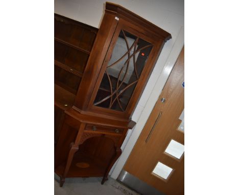 An Edwardian mahogany and inlaid corner display on stand having shell design inlay to under shelf, overall height approx. 203