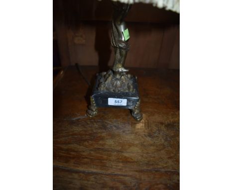 A marble based table lamp of brass cherub design