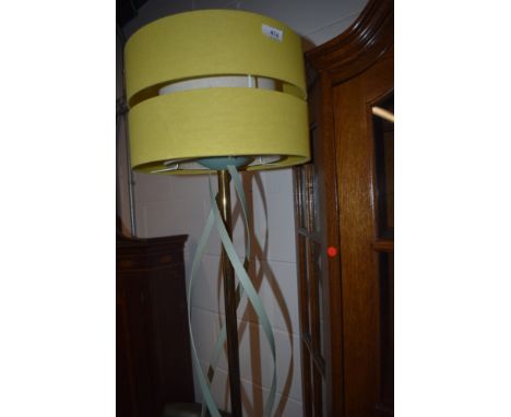 A vintage standard lamp having brass and metal twist frame , later complimentary shade,cable removed.