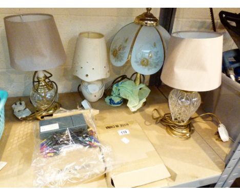 Shelf of mixed table lamps