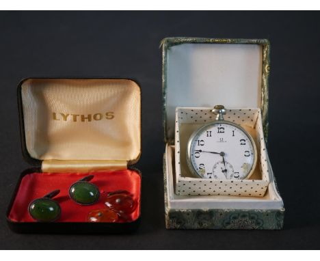 An Omega Swiss white metal pocket watch with white enamel dial (damaged and not working) along with a pair of silver and jade