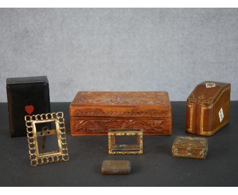 A leather gilded and painted card box with playing card motifs, a lacquered heart motif card box, a small brass picture frame