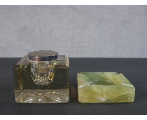 A silver lidded Mappin and Webb large glass inkwell with star cut base along with a carved alabaster ashtray. H.8.5 W.10.5 D.