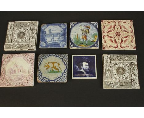 A collection of ceramic tiles, including four 19th and 20th century Delft tiles one with a charging bear. L.15.5 W.15.5cm. 