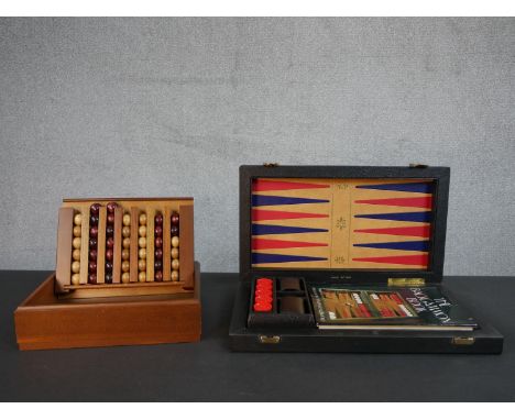 A vintage K&amp;C Ltd, London Backgammon set along with a Captains Mistress game. H.6 W.43 D.25cm 