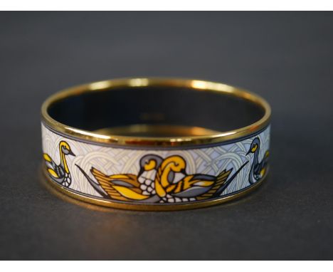 Hermès, a gold plated and enamel duck design bangle with white ground, makers mark to interior. Diam.6.5cm 