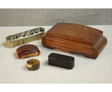 A 19th century papier mache snuff box along with an Art Nouveau foliate design clothes brush, horn napkin ring and two trinke