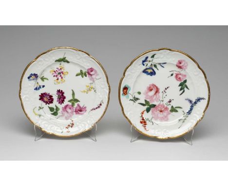 PAIR OF NANTGARW PORCELAIN DESSERT PLATES circa 1813-1820, each painted with full blown roses and wild summer flowers, C-scro