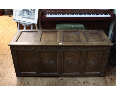 Jointed oak four panel front coffer, 59cm by 138.5cm.