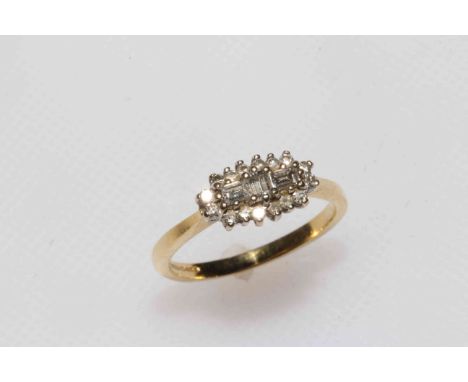 18 carat gold and diamond cluster ring set with baguettes and brilliants, size N.