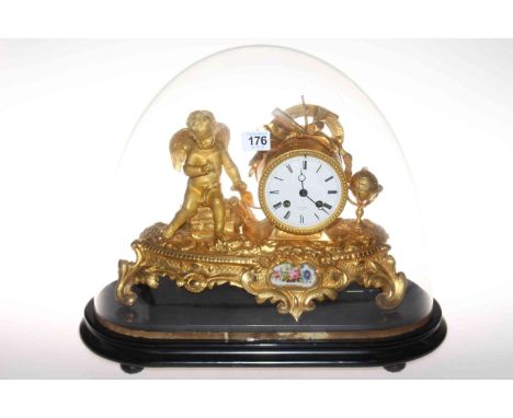 Highly ornate gilt metal mantel clock mounted with wing cherub, having enamelled circular dial above floral decorated enamel 