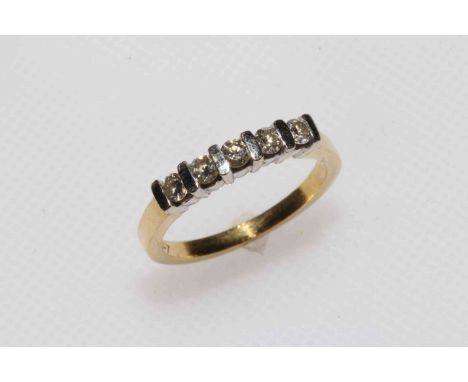 18 carat gold and five stone diamond ring, size M.