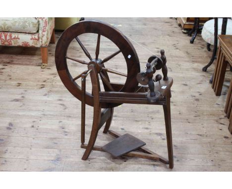 Vintage wooden spinning wheel, 86cm by 73cm.