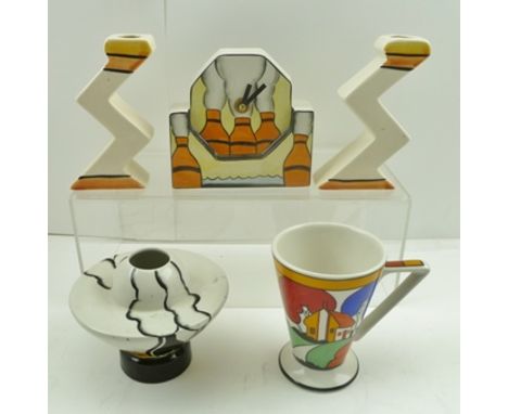 A QUANTITY OF ART DECO DESIGN POTTERY ITEMS, including a table clock, pair of "Zig-Zag" candlesticks, a mug and a bud vase, 9