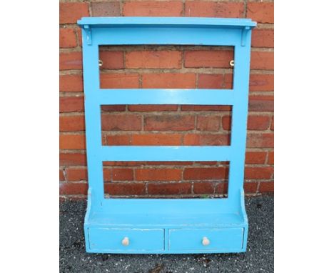 A VICTORIAN DESIGN PINE WALL RACK fitted shelf and two drawers to the base, in distressed blue paint finish, 64cm wide 