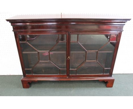 A 19TH CENTURY MAHOGANY CABINET, having two astragal glazed doors, on bracket feet, 116cm wide 