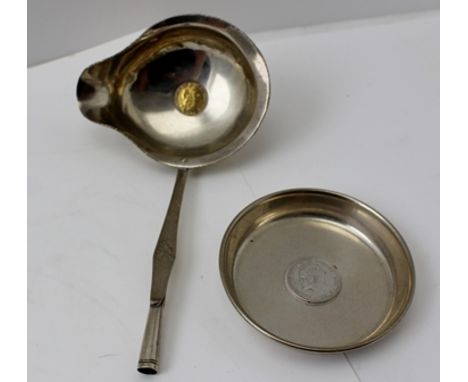 AN 18TH CENTURY WHITE METAL TODDY LADLE having lipped bowl inset with a coin, together with a coin inset PIN DISH, 7cm diamet