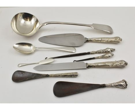 A SILVER PLATED SOUP LADLE AND VARIOUS SILVER HANDLED ITEMS includes pie slice, shoe horns, etc. 