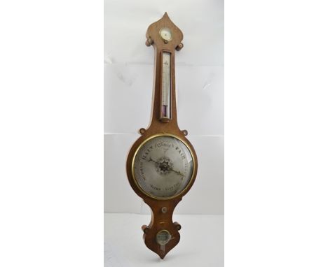 A LATE 19TH CENTURY MAHOGANY CASED ONION TOP WHEEL BAROMETER, silvered dial, 25cm diameter with thermometer and hydrometer, o