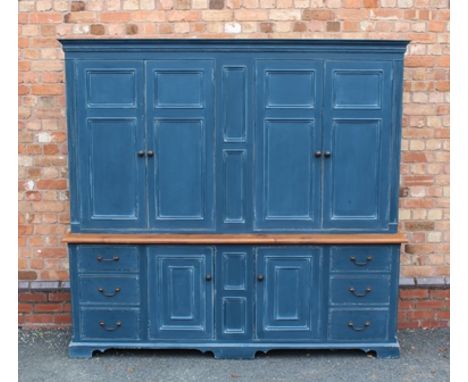 A GEORGIAN DESIGN PAINTED PINE HOUSEKEEPER'S CUPBOARD, having dentil frieze over four panelled doors to top, over base fitted