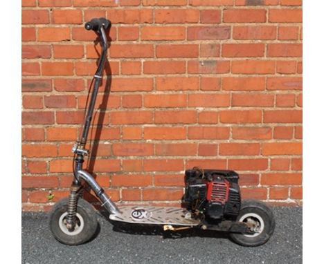 AN ENGINEER BUILT METAL FRAMED SCOOTER having two stroke petrol engine on chain driven rear wheel, with pnuematic tyres 