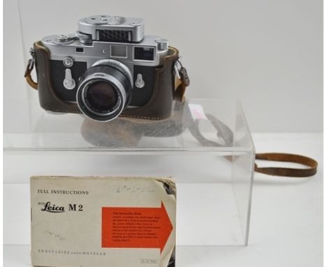 A LEICA M2 RANGEFINDER 35MM CAMERA, body no. 947906, fitted with an Ernst Leitz GM6H, Wetzlar Summicron f= 5cm 1:2 Nr. 159332