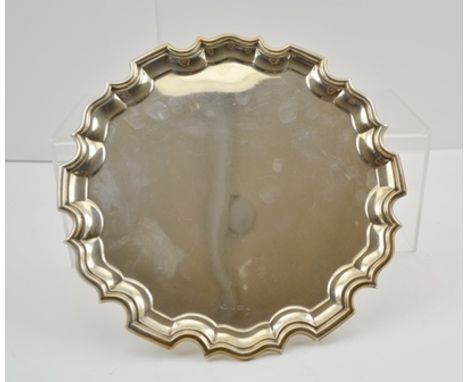 ADIE BROTHERS OF BIRMINGHAMA GEORGIAN DESIGN SILVER SALVER having pie-crust edge, raised on three button feet, Birmingham 192