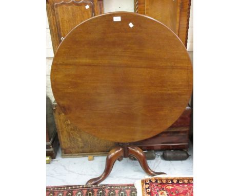 George III mahogany circular tilt-top pedestal table with turned column support and tripod base