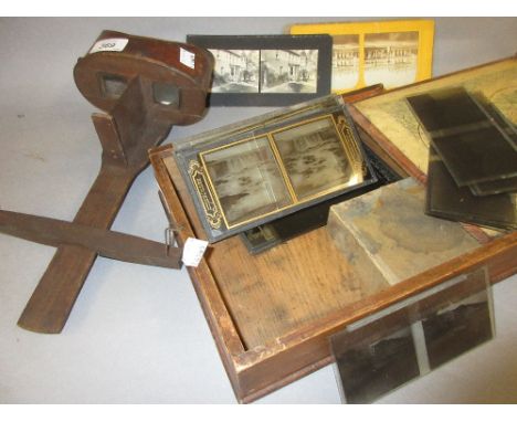 Hand held stereo viewer together with a quantity of cards and a quantity of glass magic lantern slides