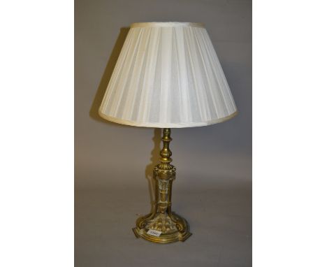 19th Century gilt brass table lamp on three scroll supports