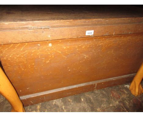 19th Century pine trunk with original painted finish, the hinged cover enclosing a candle box with concealed drawers