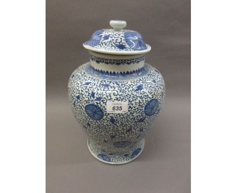 Chinese Kangxi blue and white temple jar and cover, decorated with an all-over floral design, marked to the base with a paint
