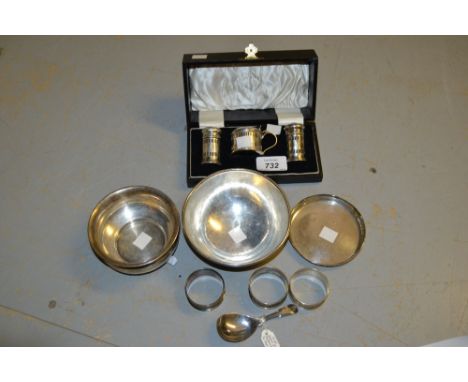 Silver three piece condiment set in original box, two silver bowls and a silver dish, silver caddy spoon and three silver nap