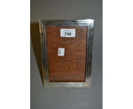 Continental rectangular silver photograph frame with engine turned decoration